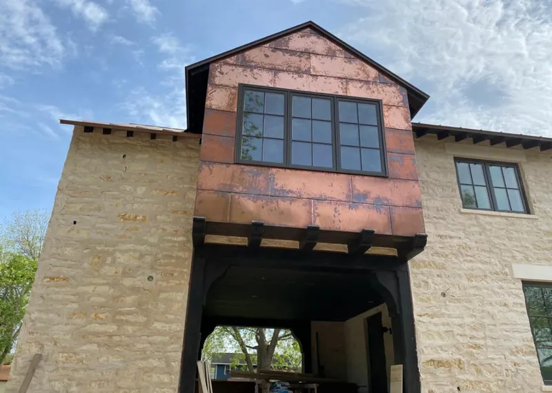Copper metal panel facade on a stone building for Metal Roof Coating in South Brooksville