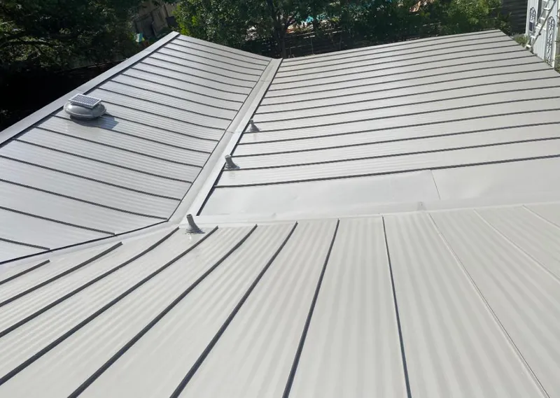 Solar attic fan installed on a metal roof for Roof Ventilation in South Brooksville